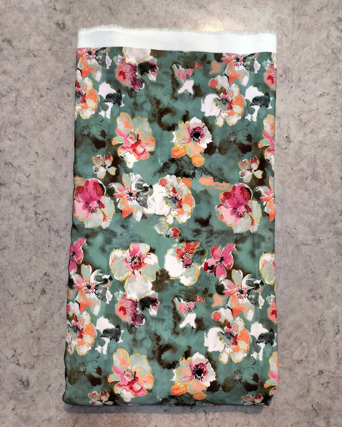 Pastel green blossom BSY dress material folded into a cut piece