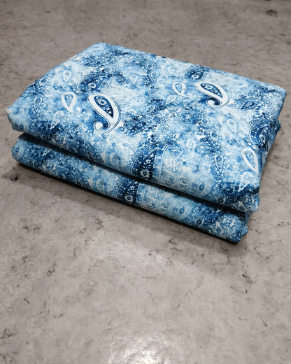 Blue floral micro crepe dress material folded into a cut piece