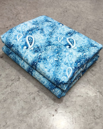Close detail of the blue floral print on micro crepe