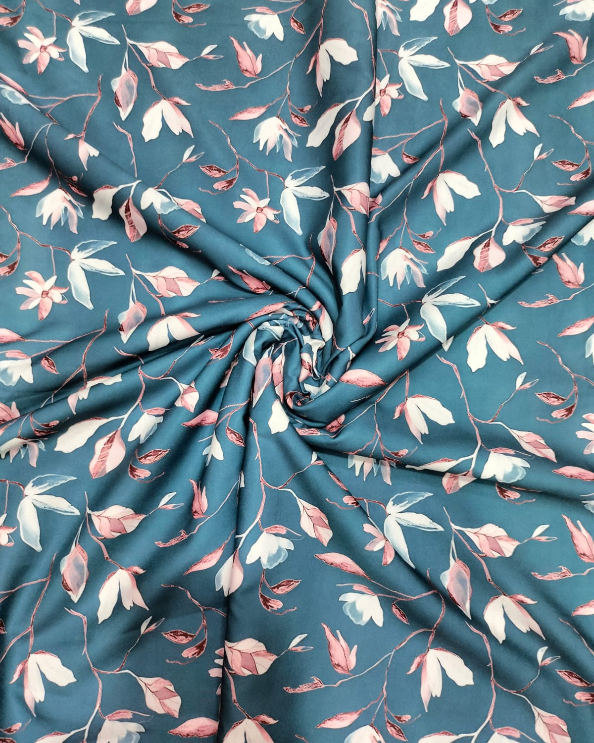 Grey floral micro crepe dress material folded into a cut piece