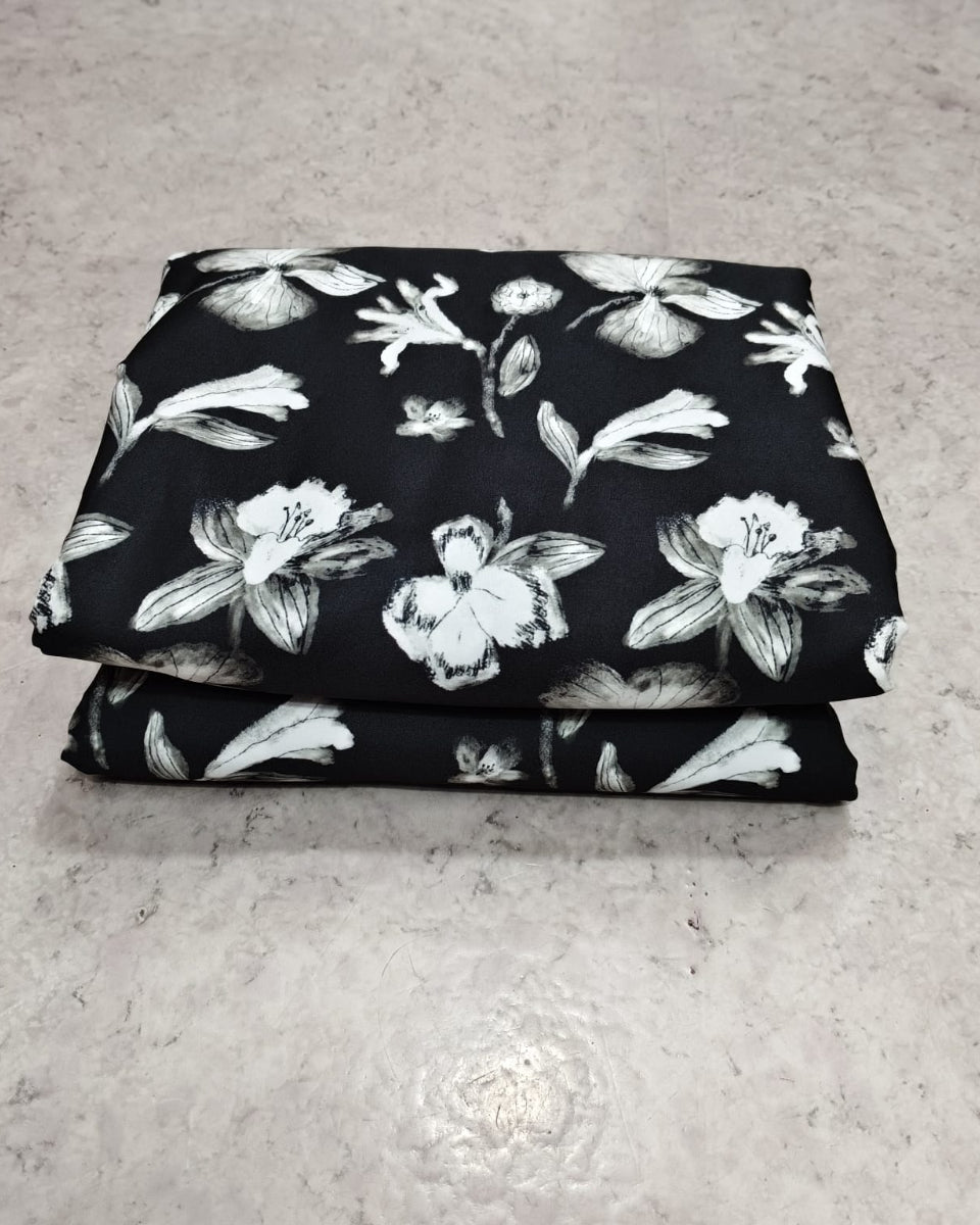 Black and white floral micro crepe fabric shown full width