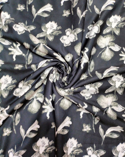 Close detail of the white floral motif on black micro crepe