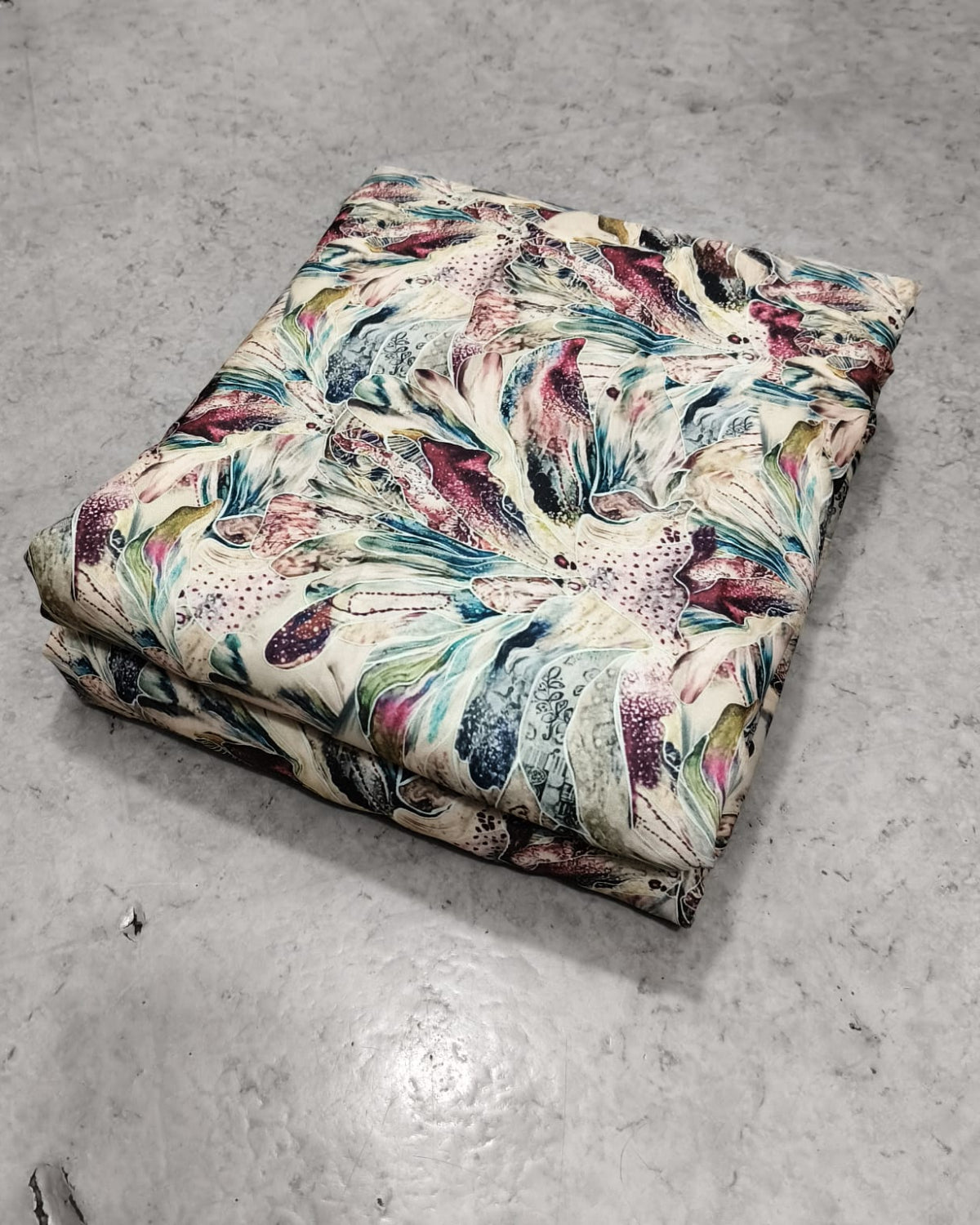 Marble abstract moss dress material folded into a cut piece