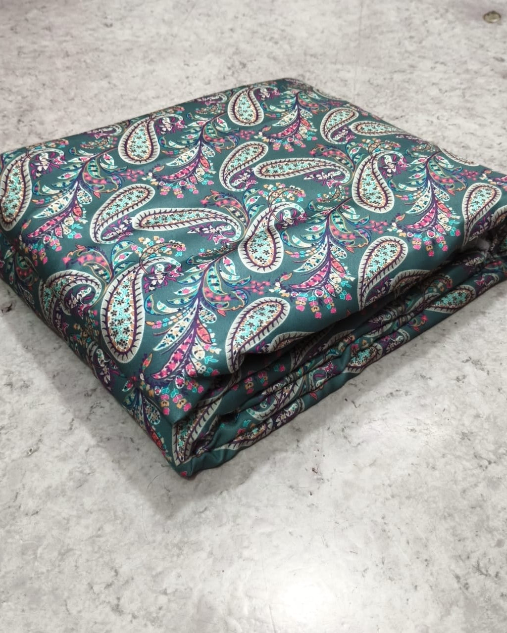 Close detail of the paisley ambi motif on moss