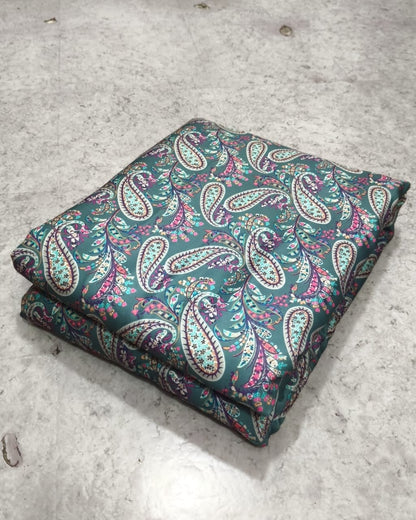 Teal paisley moss fabric texture in close up
