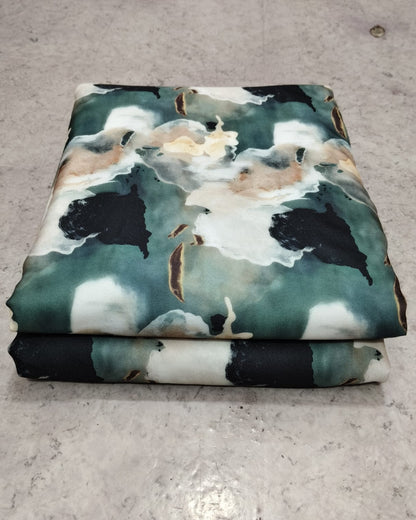 Teal and black watercolour moss fabric shown full width
