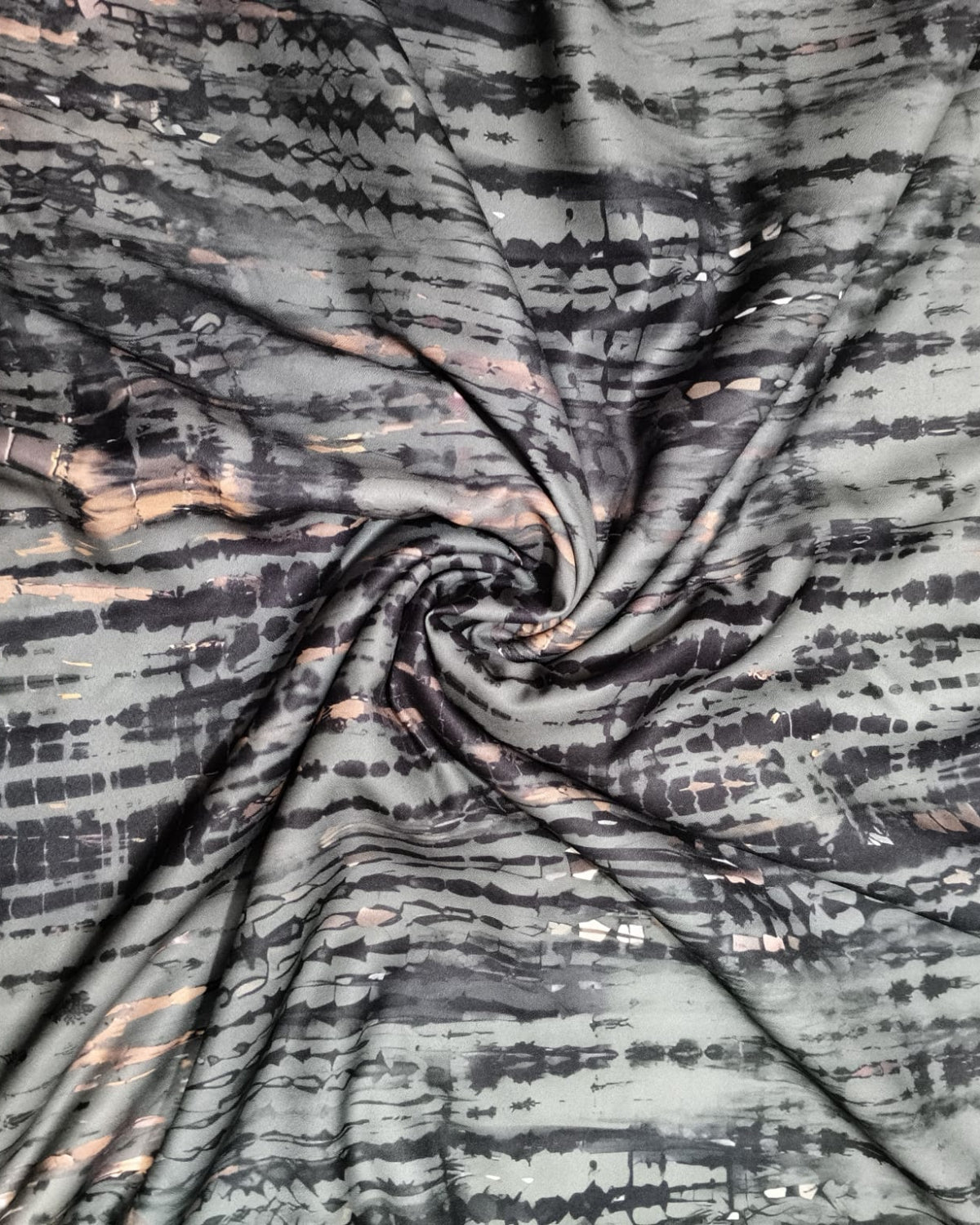 Teal and black shibori moss fabric shown full width