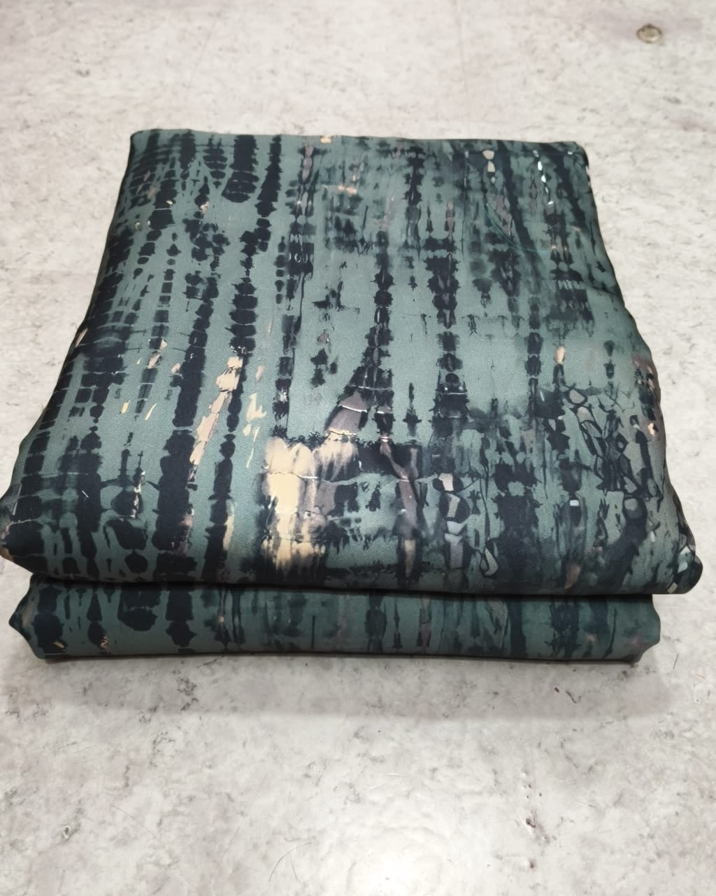 Close detail of the shibori resist pattern on moss
