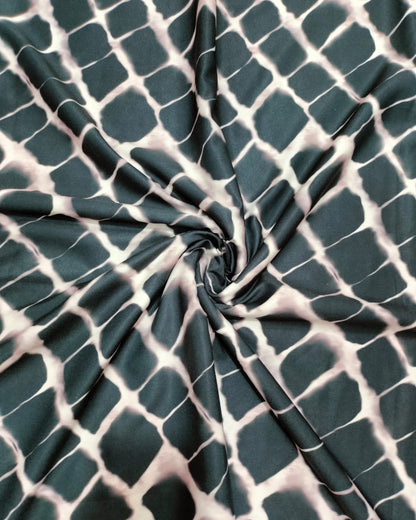 Close detail of the black and white grid print on micro crepe