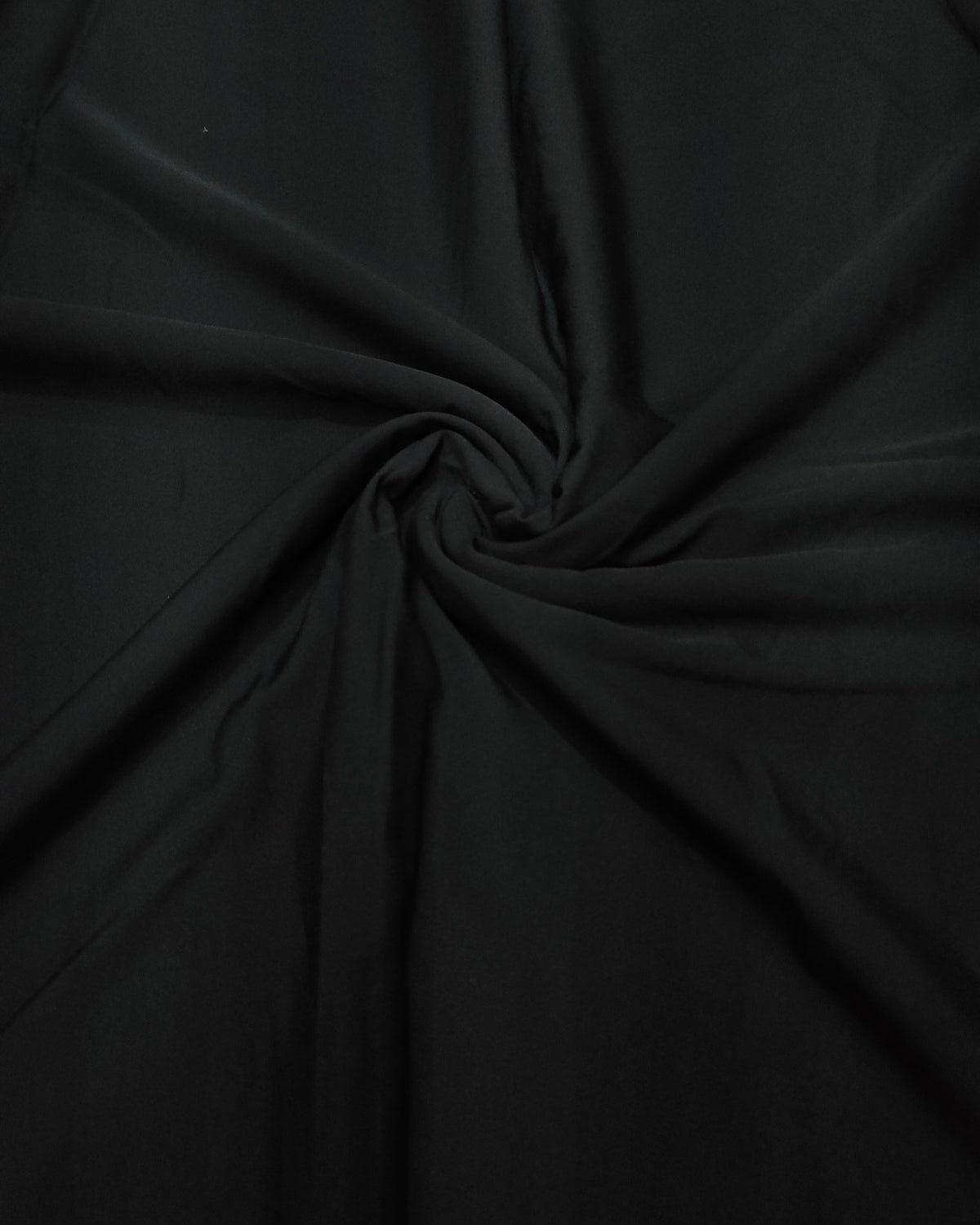 Close up of the black micro crepe weave and crinkle texture