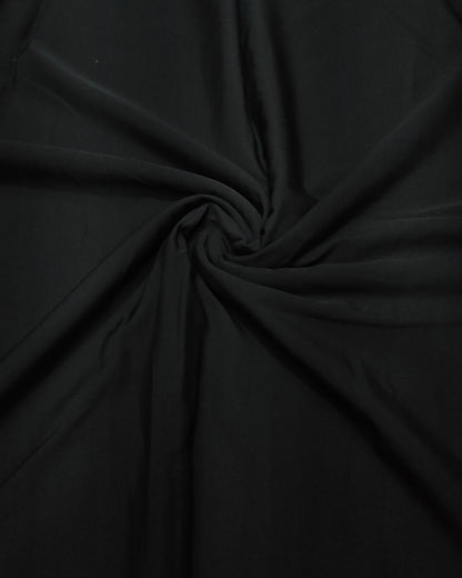 Close up of the black micro crepe weave and crinkle texture