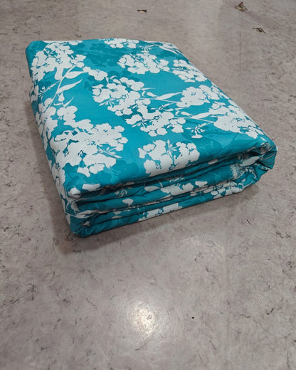 Teal and white blossom micro crepe fabric in close up