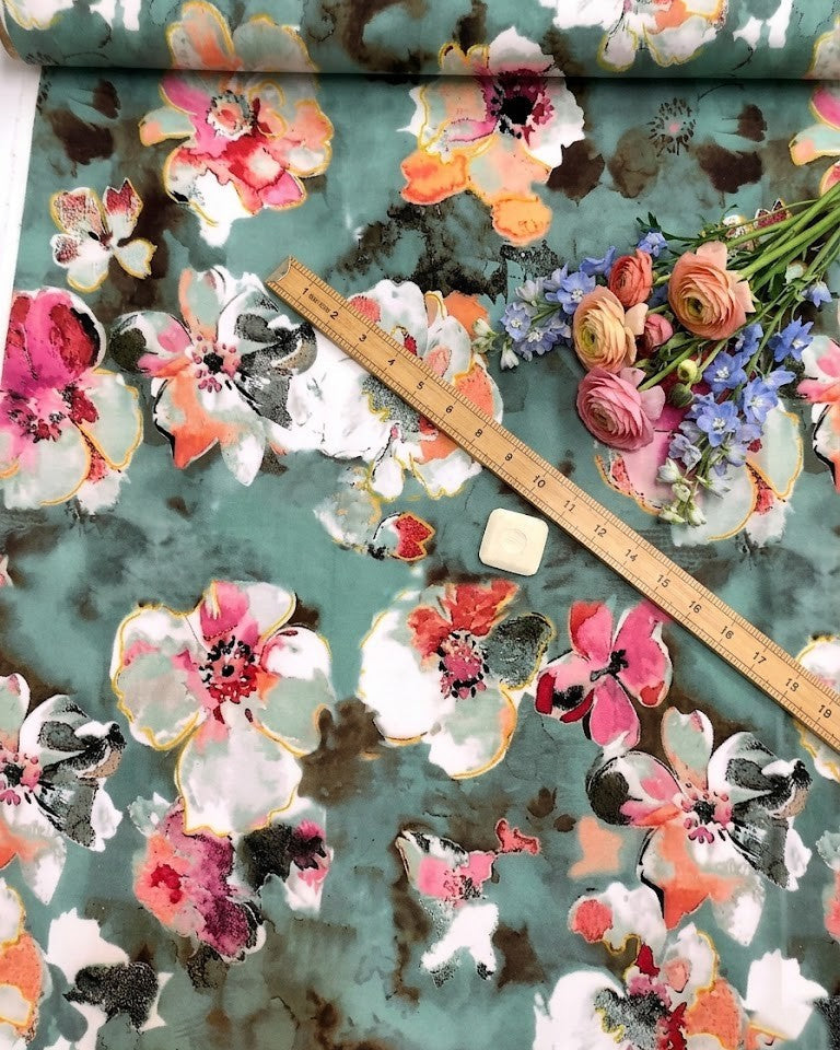 Close detail of the pink and white blossom motif on pastel green BSY