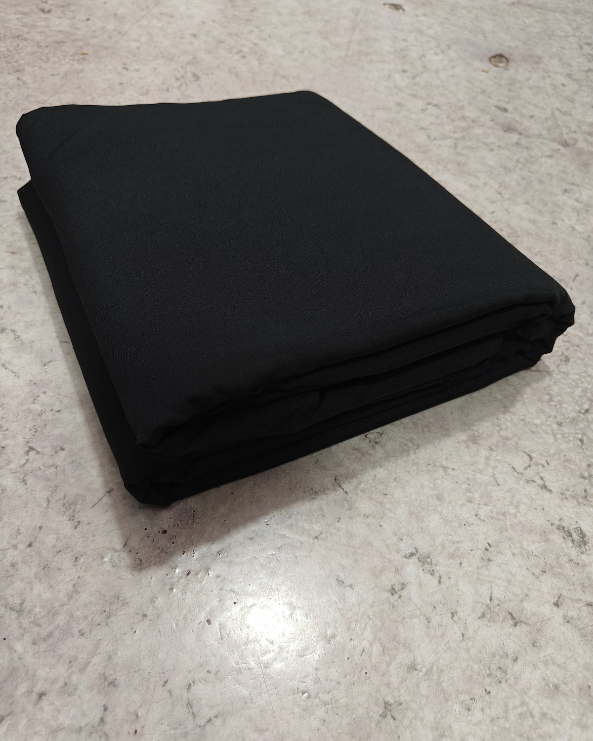 Plain black micro crepe unstitched salwar fabric folded