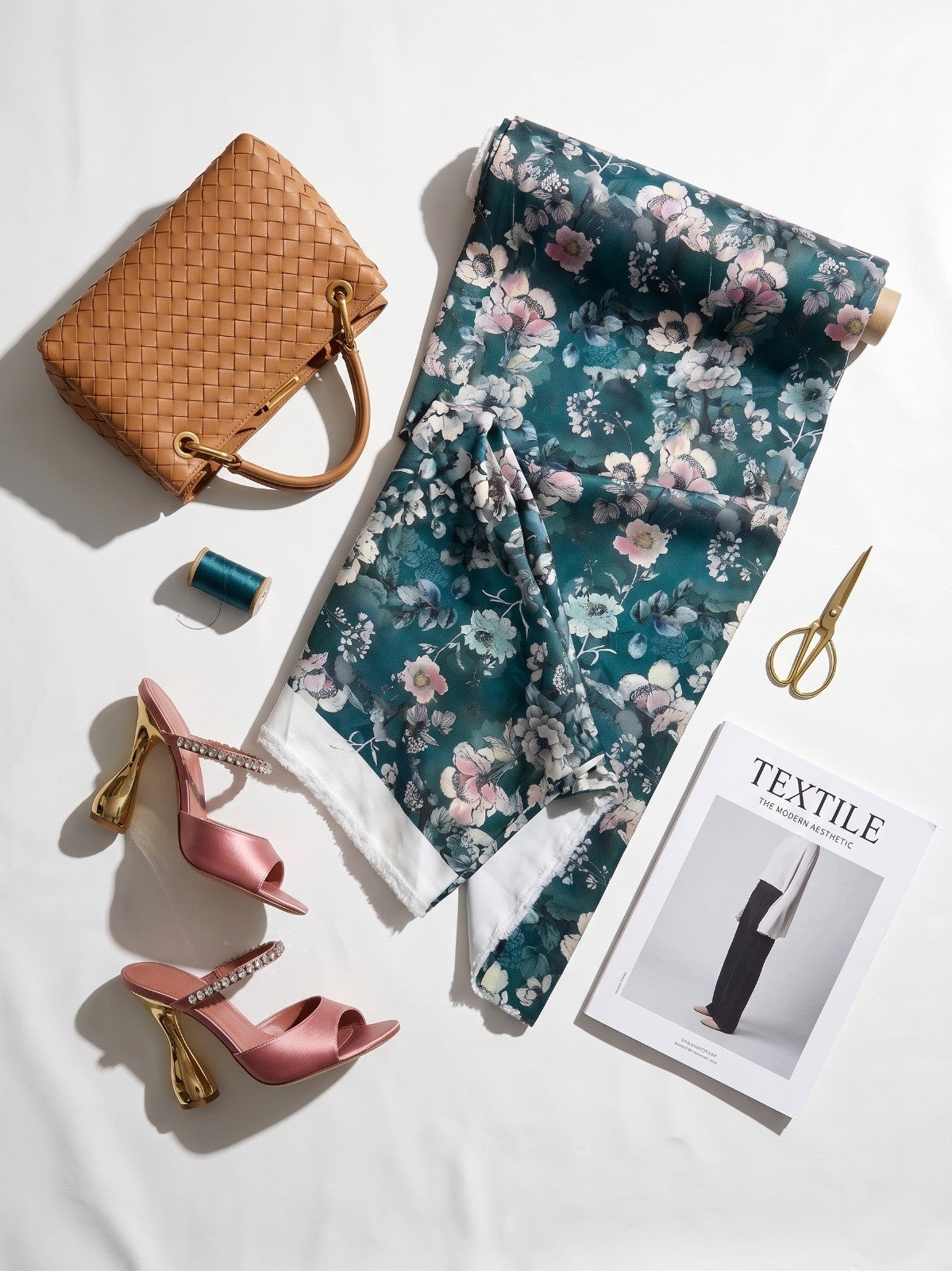 Teal and mint floral BSY fabric in a styled flat lay